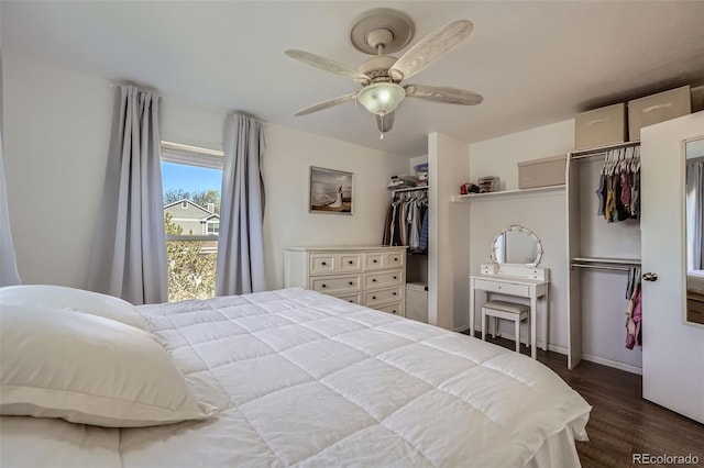 10064 Owens St, Broomfield, CO 80021 - bedroom with dark wood-style flooring, baseboards, and ceiling fan