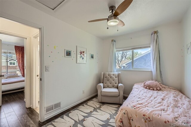10064 Owens St, Broomfield, CO 80021 - bedroom featuring multiple windows, wood finished floors, baseboards, and a ceiling fan