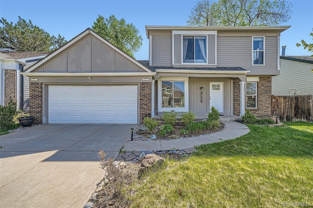 10064 Owens St, Broomfield, CO 80021 - traditional-style home featuring brick siding, driveway, and a garage