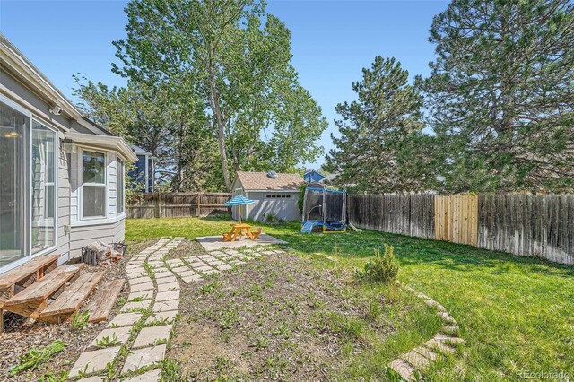 10064 Owens St, Broomfield, CO 80021 - view of yard with entry steps and a patio area