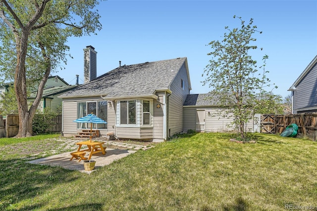 10064 Owens St, Broomfield, CO 80021 - rear view of house featuring roof with shingles, a patio area, and a chimney