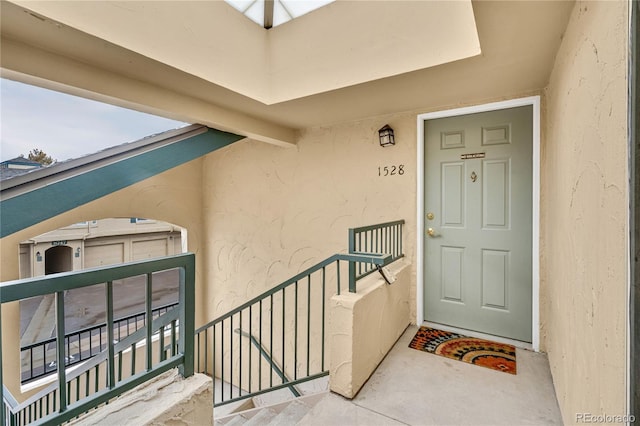 doorway to property with stucco siding