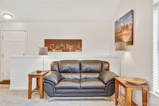 living room with carpet and vaulted ceiling