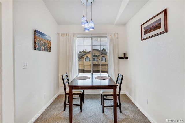 dining area with carpet and baseboards