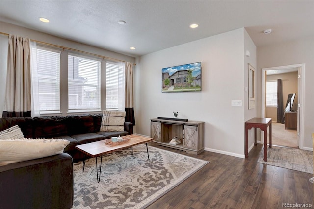 6612 N Ceylon St, Denver, CO 80249 - living room featuring dark wood-style floors, plenty of natural light, baseboards, and recessed lighting