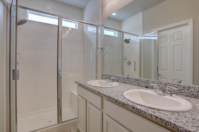 6612 N Ceylon St, Denver, CO 80249 - full bath featuring a shower stall and double vanity