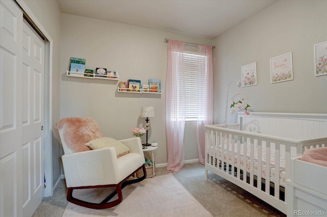 6612 N Ceylon St, Denver, CO 80249 - bedroom with carpet floors, a nursery area, a closet, and baseboards