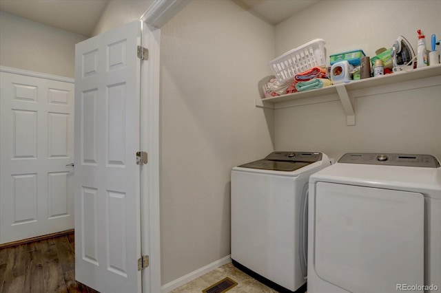 6612 N Ceylon St, Denver, CO 80249 - laundry area featuring washing machine and dryer and baseboards