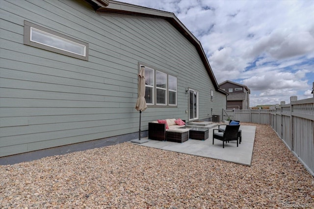 6612 N Ceylon St, Denver, CO 80249 - back of house featuring outdoor lounge area, a patio area, and a fenced backyard