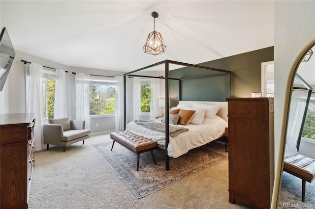 bedroom featuring carpet and multiple windows