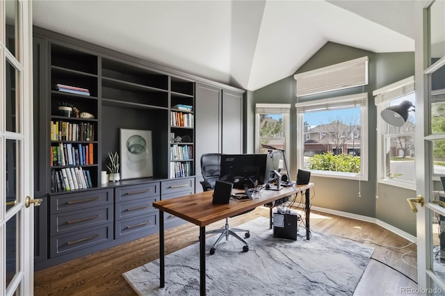 office area with wood finished floors and lofted ceiling