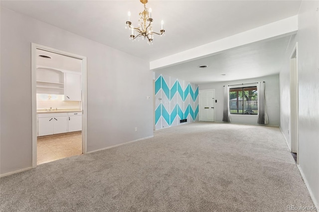 708 Revere St, Aurora, CO 80011 - unfurnished room featuring light carpet and a chandelier