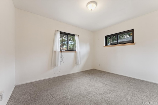 708 Revere St, Aurora, CO 80011 - unfurnished room featuring plenty of natural light and carpet flooring