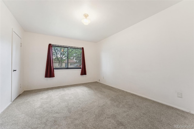 708 Revere St, Aurora, CO 80011 - carpeted empty room featuring baseboards