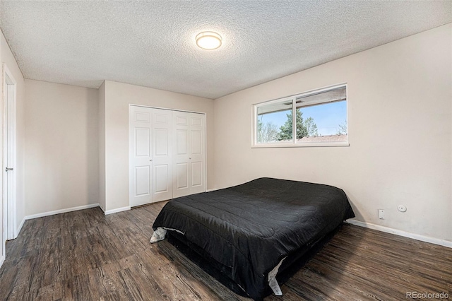 12662 W Virginia Ave, Lakewood, CO 80228 - bedroom featuring a closet, a textured ceiling, wood finished floors, and baseboards