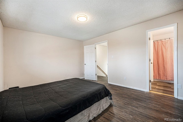 12662 W Virginia Ave, Lakewood, CO 80228 - bedroom featuring baseboards, a textured ceiling, and dark wood-type flooring