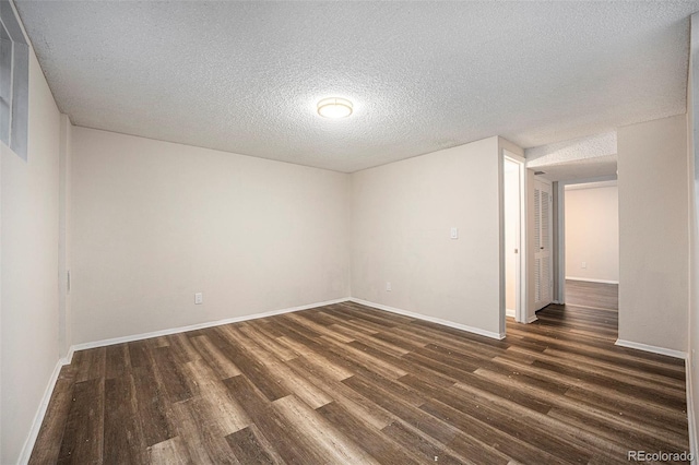 12662 W Virginia Ave, Lakewood, CO 80228 - unfurnished room featuring a textured ceiling, wood finished floors, and baseboards