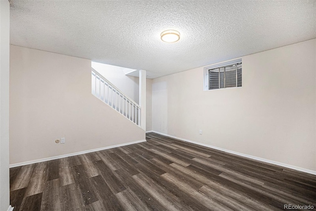 12662 W Virginia Ave, Lakewood, CO 80228 - finished below grade area featuring a textured ceiling, stairway, wood finished floors, and baseboards