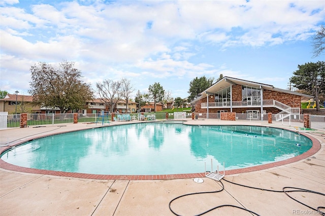 12662 W Virginia Ave, Lakewood, CO 80228 - community pool featuring a patio area and fence