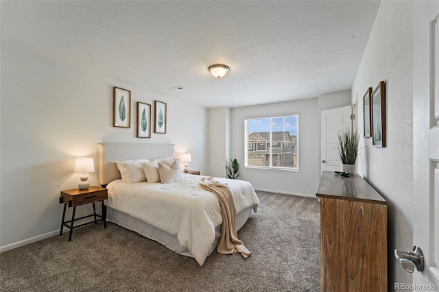 bedroom with visible vents, baseboards, dark colored carpet, and a textured ceiling