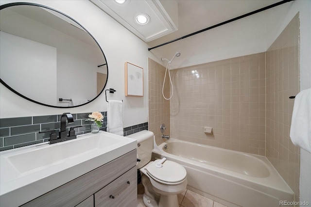 full bath with bathing tub / shower combination, tile patterned flooring, vanity, and toilet