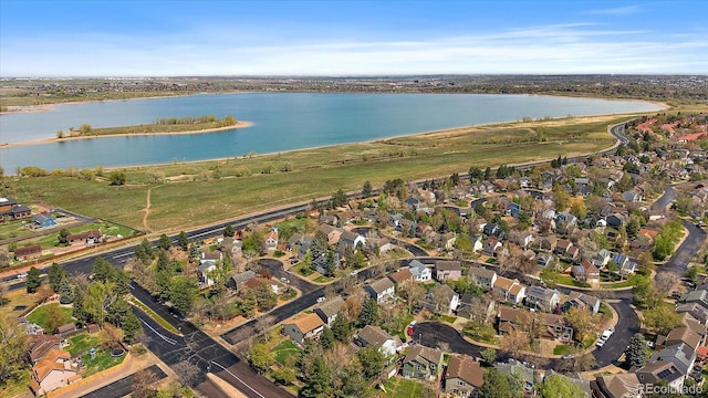 drone / aerial view with a residential view and a water view