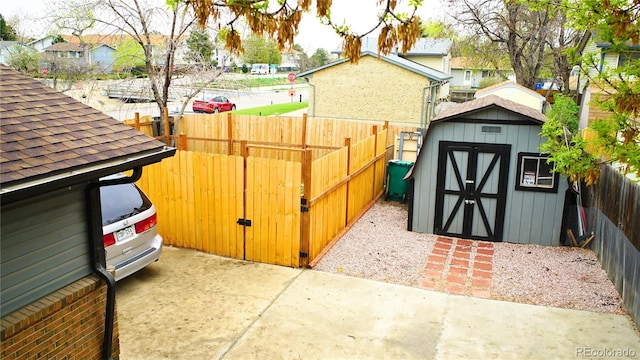 1528 Coronado Pkwy, Denver, CO 80229 - view of shed featuring a fenced backyard and a residential view