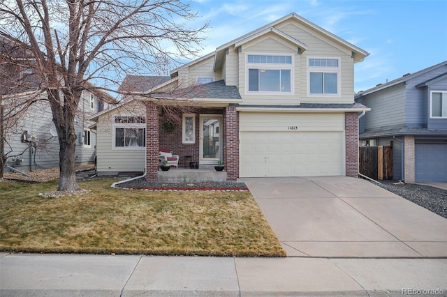 view of front of house featuring brick siding, a shingled roof, concrete driveway, an attached garage, and a front lawn