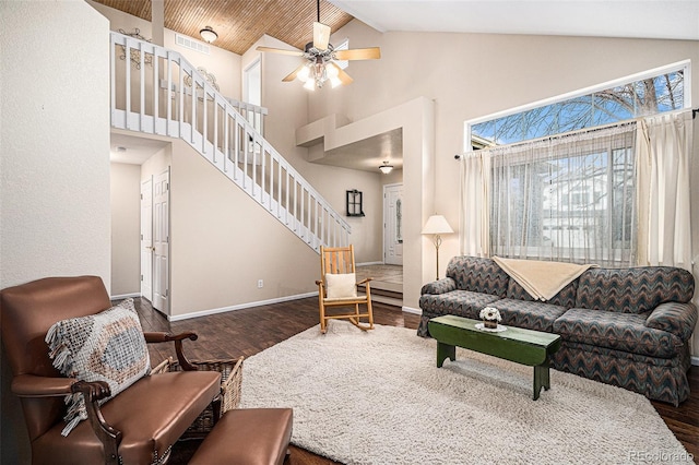 living room with high vaulted ceiling, dark wood-type flooring, visible vents, baseboards, and stairway