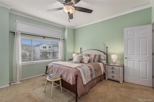 carpeted bedroom with ornamental molding, ceiling fan, and baseboards