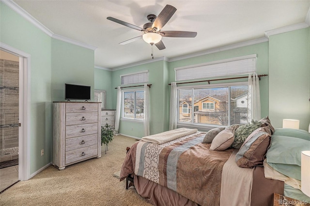 bedroom with baseboards, crown molding, and light colored carpet