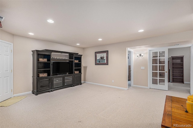 living room featuring carpet floors, recessed lighting, and baseboards