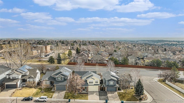 birds eye view of property with a residential view