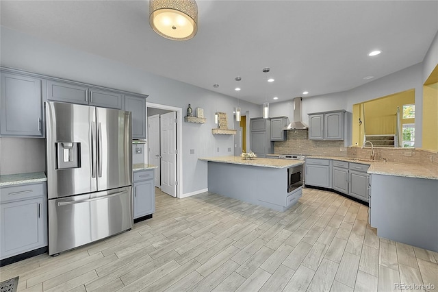20532 E Lake Cir, Centennial, CO 80016 - kitchen featuring stainless steel refrigerator with ice dispenser, gray cabinets, wall chimney exhaust hood, a sink, and light wood finished floors
