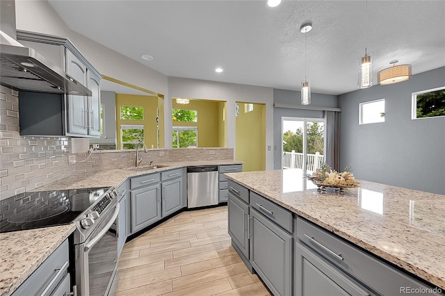 20532 E Lake Cir, Centennial, CO 80016 - kitchen with appliances with stainless steel finishes, gray cabinetry, a sink, decorative backsplash, and recessed lighting