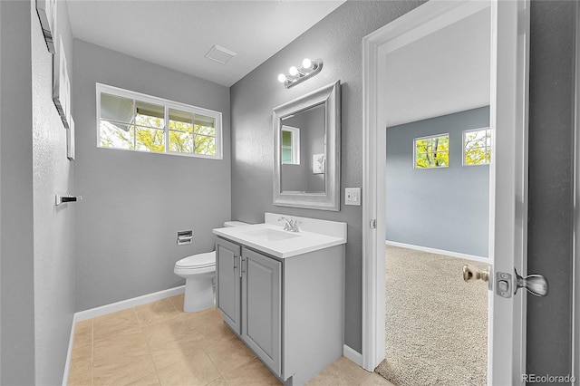 20532 E Lake Cir, Centennial, CO 80016 - bathroom featuring vanity, toilet, tile patterned floors, and baseboards