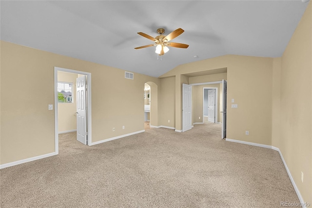 20532 E Lake Cir, Centennial, CO 80016 - empty room with ceiling fan, arched walkways, light carpet, vaulted ceiling, and baseboards