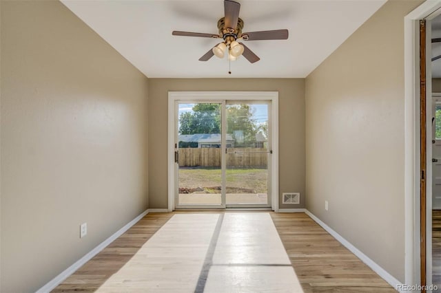 3055 Carson St, Aurora, CO 80011 - unfurnished room featuring a ceiling fan, light wood finished floors, and baseboards