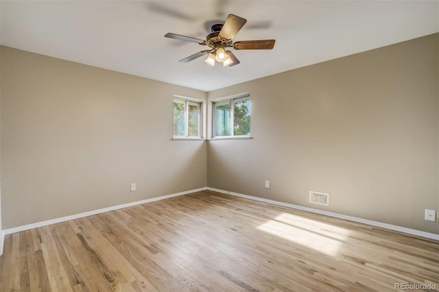3055 Carson St, Aurora, CO 80011 - spare room featuring baseboards, a ceiling fan, and light wood-style flooring