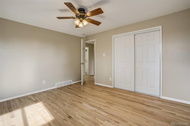 3055 Carson St, Aurora, CO 80011 - unfurnished bedroom featuring light wood-style floors, baseboards, a closet, and ceiling fan