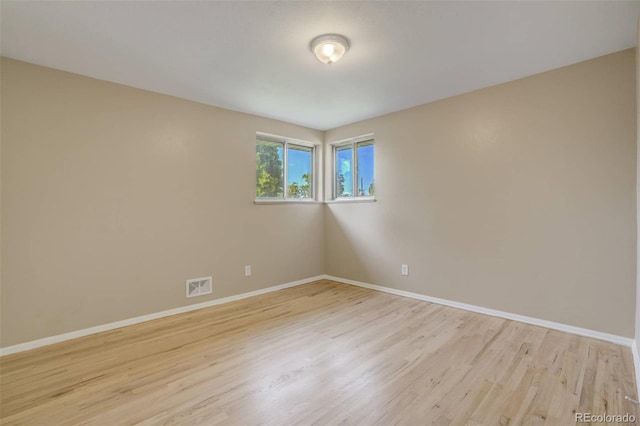 3055 Carson St, Aurora, CO 80011 - empty room with light wood-style flooring and baseboards