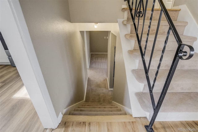 3055 Carson St, Aurora, CO 80011 - stairway featuring wood finished floors and baseboards