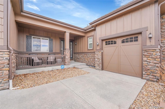 view of front of property with a garage and covered porch