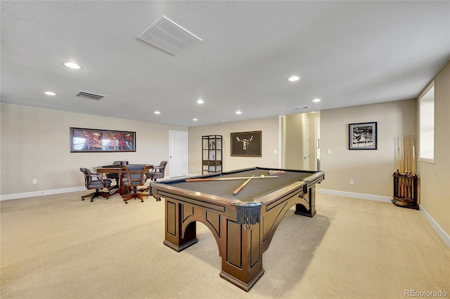 rec room with light carpet, billiards, and a textured ceiling