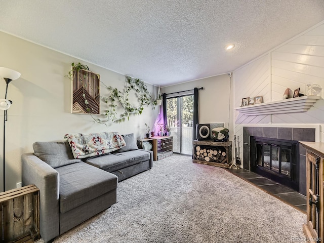 carpeted living room featuring a fireplace, french doors, a textured ceiling, and wooden walls