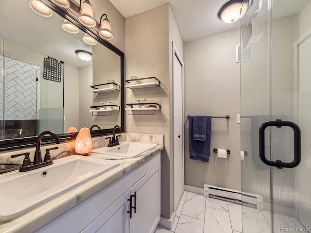 bathroom with vanity, baseboard heating, and a shower with shower door