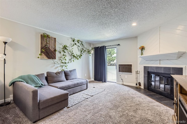 2280 S Oswego Way Unit 104, Aurora, CO 80014 - carpeted living room with a tile fireplace and a textured ceiling