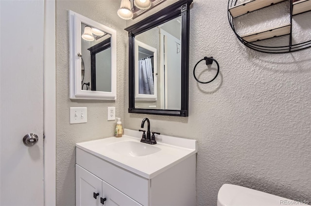 2280 S Oswego Way Unit 104, Aurora, CO 80014 - bathroom featuring a textured wall and vanity