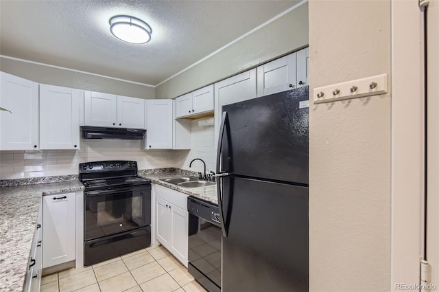 2280 S Oswego Way Unit 104, Aurora, CO 80014 - kitchen with black appliances, under cabinet range hood, a textured ceiling, white cabinetry, and light tile patterned flooring