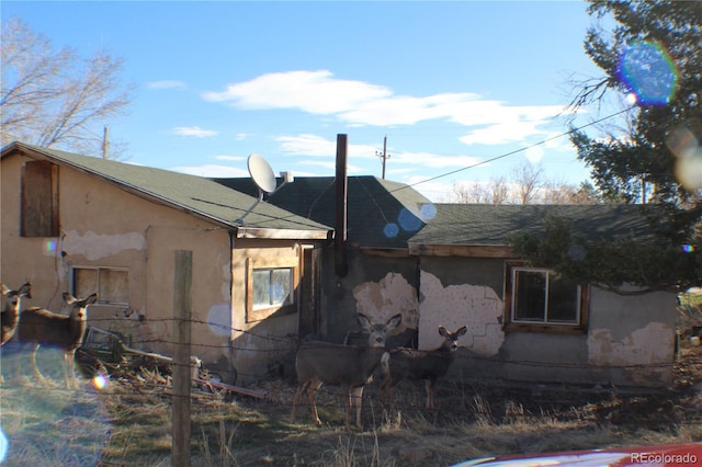 view of property exterior with stucco siding